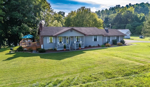 Riverfront home with dock, mountain view, grill, firepit, smart TVs