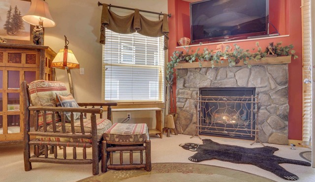 Riverfront mountain townhouse with pool & hot tub, patio, & easy ski access