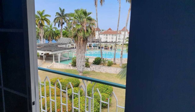 Romantic condo with private beach and pool