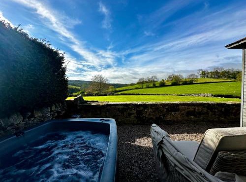 Romantic four poster Cottage private outdoor Hot Tub & Sauna at Harthill Hall plus private daily use of indoor pool and sauna 1 hour per day