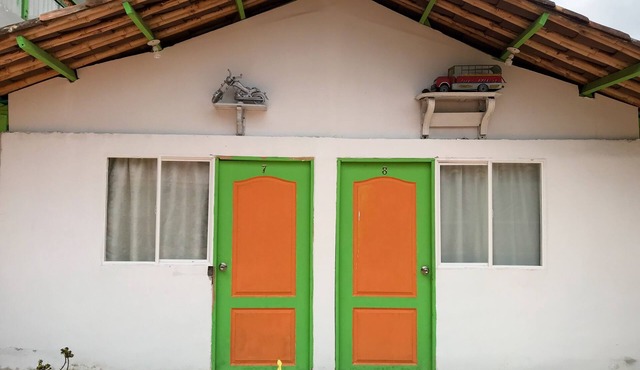 Room with 1 double bed and 2 single beds