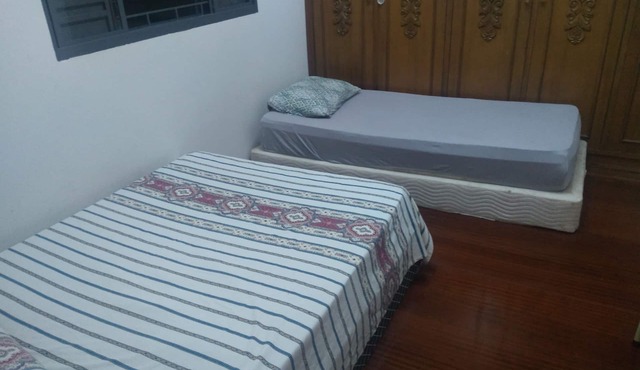 Room with two beds in pensionato in Maringá/pr