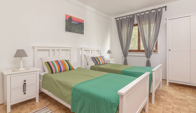 Room with two single beds