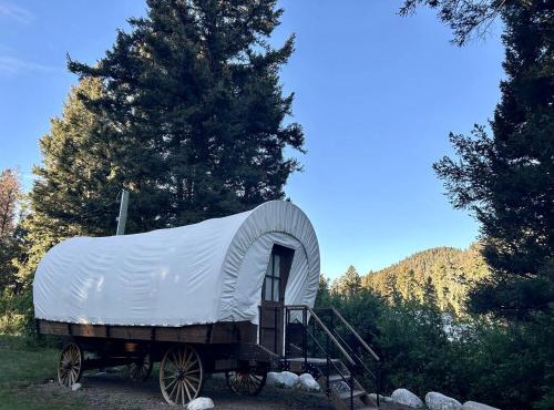 Rustic Conestoga Wagon Stay with Lodge Amenities near Boulder Creek, Montana