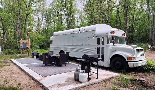 Rustic Converted School Bus with Outdoor Shower Near ORV Trails in Manistee National Forest, Michigan