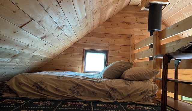 Rustic Solar cabin in the woods off grid glamming at its finest near Mara lake