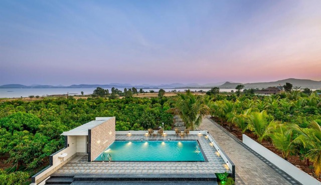 SaffronStays Mango Lakeview Villa - 3BR pool villa amid mango farms with Gangapur Dam views, deck & games