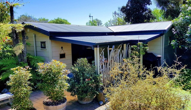 Secluded Riverside Cottage set in native garden.