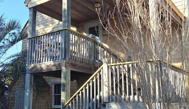 Second-floor two-bedroom villa with screened porch.