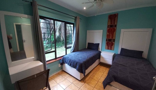Self catering accommodation with a garden view. 100mt from the beach
