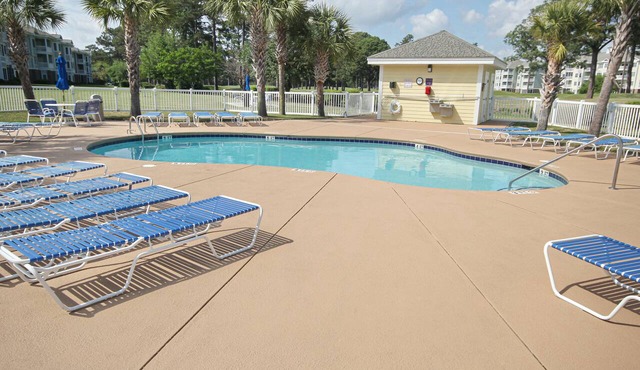 Serene condo with pool, balcony, full kitchen, washer/dryer, and TV