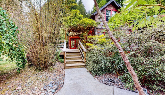 Serene home with a game room, firepit, & grill