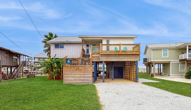 Serene sound-front home with a covered patio, dock, and swing bed