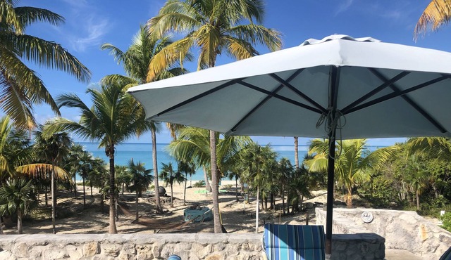 Shangri-La- beach front views of crystal-clear blue waters and surreal sunsets.
