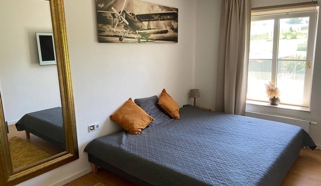 Shared living room, open kitchen, wellness, 2 double bedrooms with bathrooms.