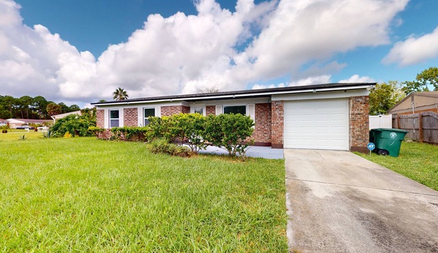 Single-level vacation home with fenced yard, W/D, & central AC - dog-friendly