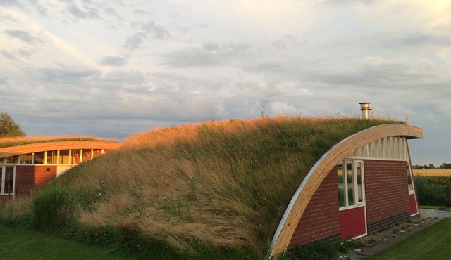 Sleeping under a grass roof on the Reitdiep in Groningen