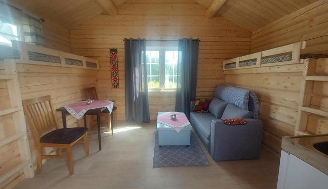 small camping cabbin with bathroom near by