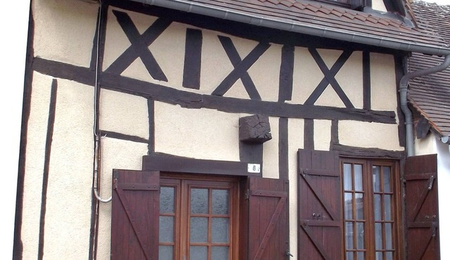 Small Half-timbered norman house in village with all convenience store