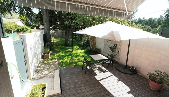 Small recent house with wooded garden