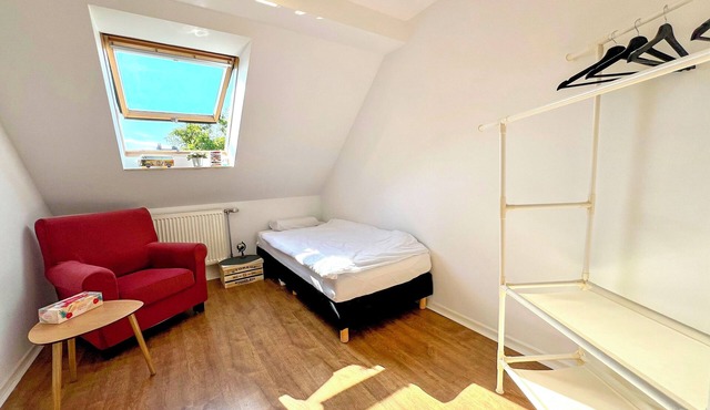 Small room with shared bathroom
