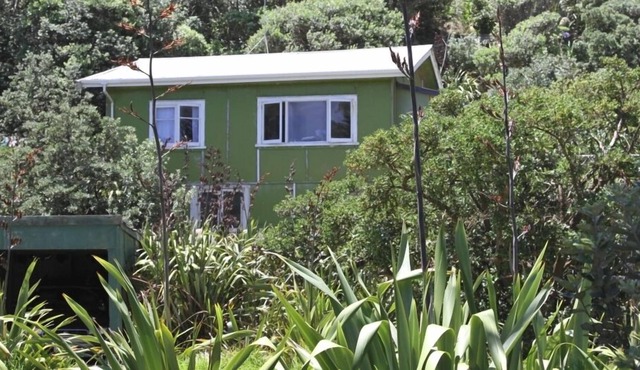 Small Traditional Family Bach within walking distance to beach.