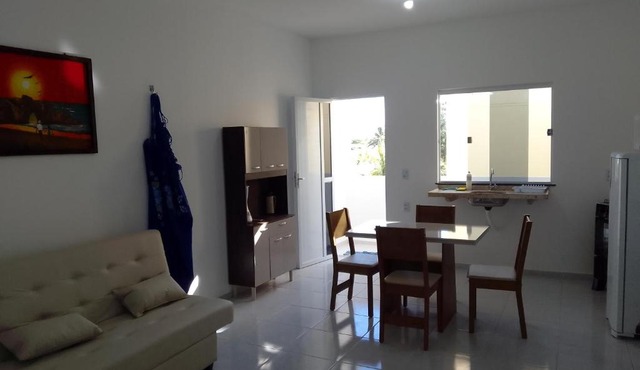 Sol Apartamento 4 - Quarto e sala com varanda e cozinha americana na praia do prea-CE