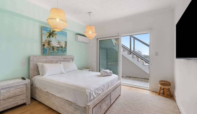 Spacious 2-Bed with Private Rooftop & BBQ Access