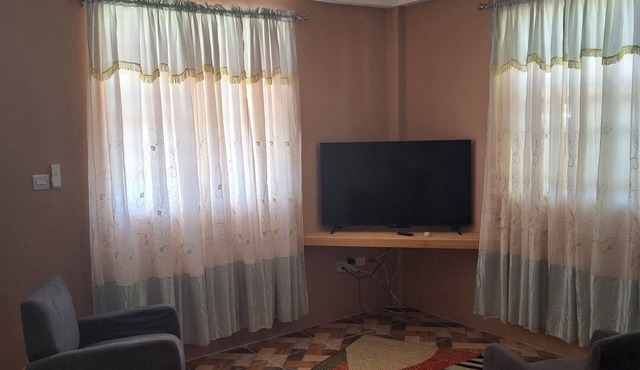 Spacious 2-bedroom apartment with AC, WiFi and parking in serene Pointe Michel