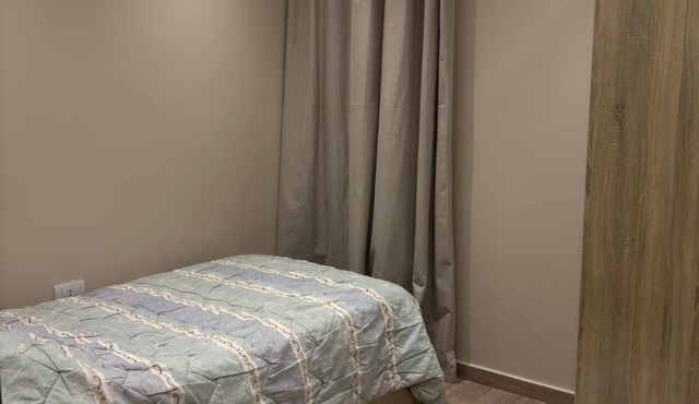 Spacious 3-bedroom apartment in tranquil Cairo with AC
