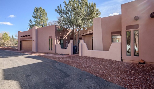 Spacious 3BR Sedona villa with forest views, patio, Wi-Fi, and garage.