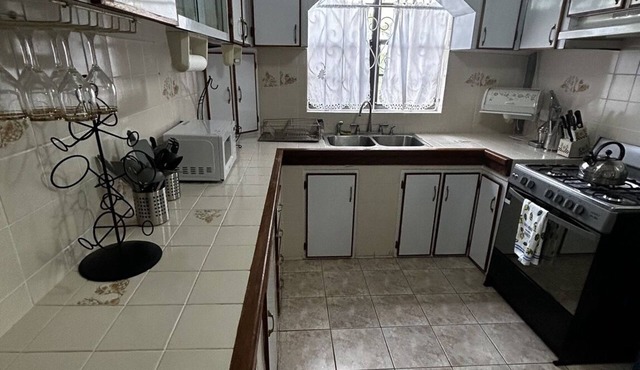 Spacious 4-bedroom residence featuring a ground floor apartment.