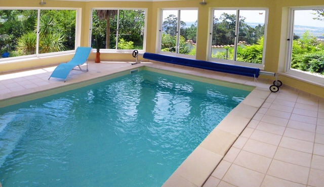 Spacious 5 Bedroom villa. Heated indoor pool. Unlimited WiFi. Cable TV.
