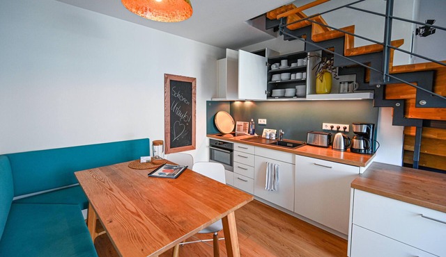 Spacious apartment over 2 floors with south-east facing balcony and playground view.