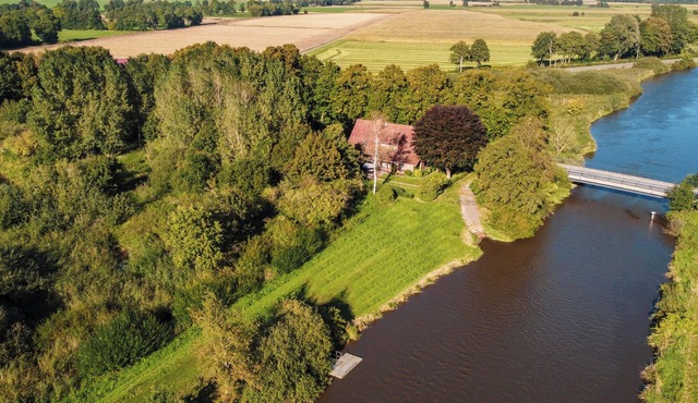 Spacious apartment on the river Aper-Tief directly on the dike in East Frisia