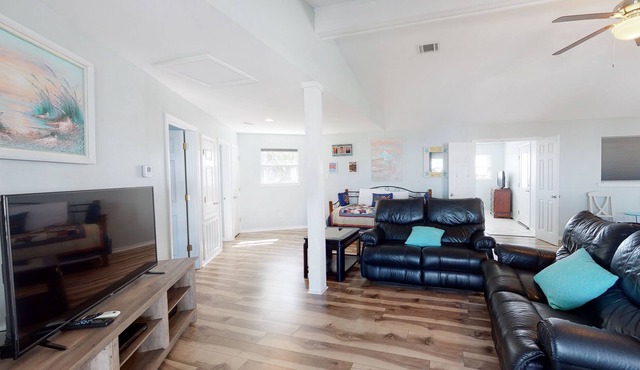 Spacious bay front getaway with dock, canal access, gas grill, & furnished deck
