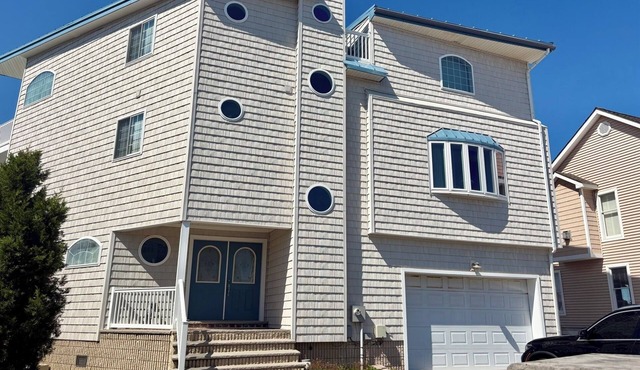 Spacious bayfront home in Avalon Manor with spectacular 360 degree views of the wetlands and inlet from the roof top deck.