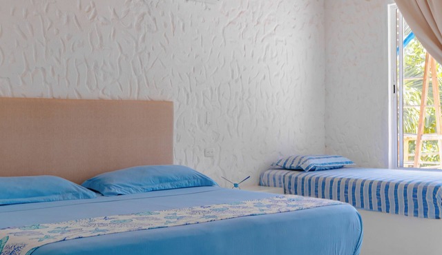 Spacious beachfront house in Rincón del Mar, white, comfortable, fresh and bright.