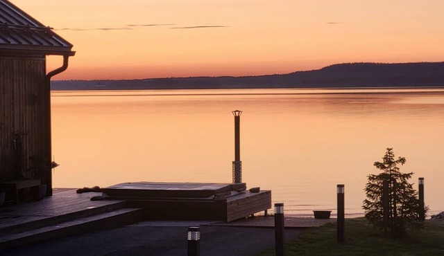 Spacious beachfront Villa with Panoramic views and outdoor sauna by the Lake.