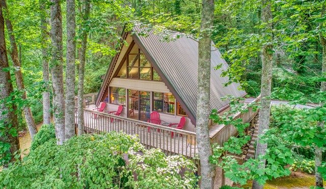 Spacious, dog-friendly A-frame cabin with a furnished deck, gas fireplace, & AC