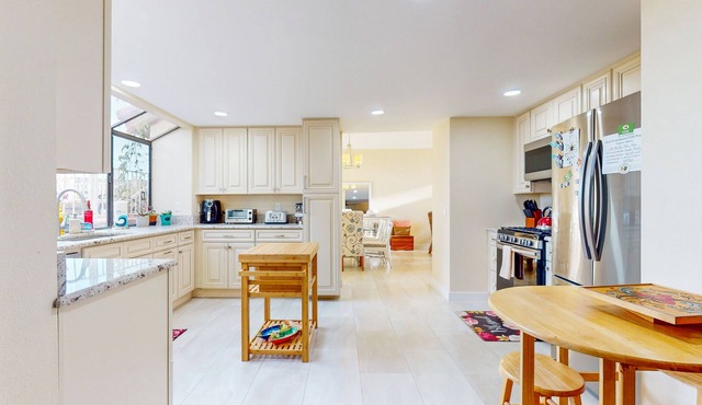 Spacious home in a great location with firepit, grill, games, AC, & smart TVs