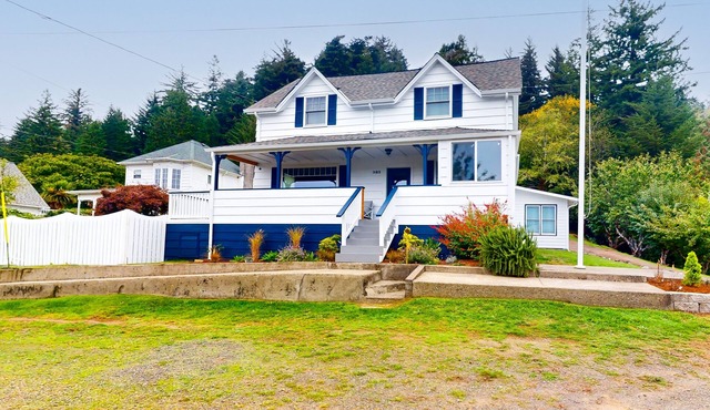 Spacious home with river views, hot tub, covered porch, deck, grill, & W/D