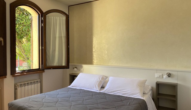 Spacious JOLLY three-room apartment equipped with all comforts, with garden and terrace.