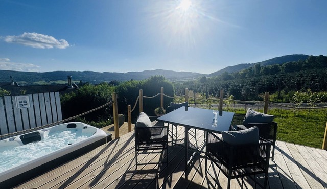 Spacious Lodge with woodburner, hot tub and beautiful views from the patio deck.