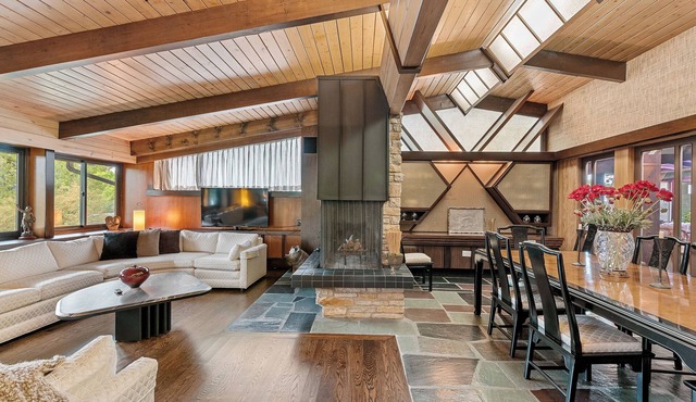 Spacious MCM home blends elegance w/retro charm. Includes pool, steam and sauna