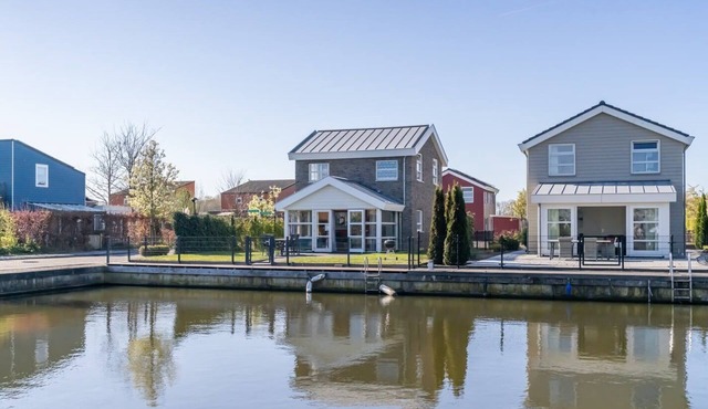 Spacious, modern island house located on a corner with fully enclosed garden, ideal for children.