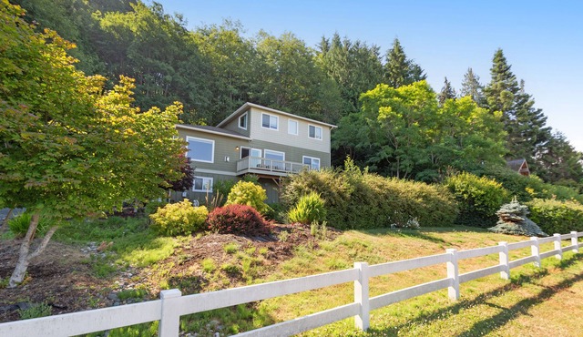 Spacious ocean-view home with forest stream, hot tub, & private community beach
