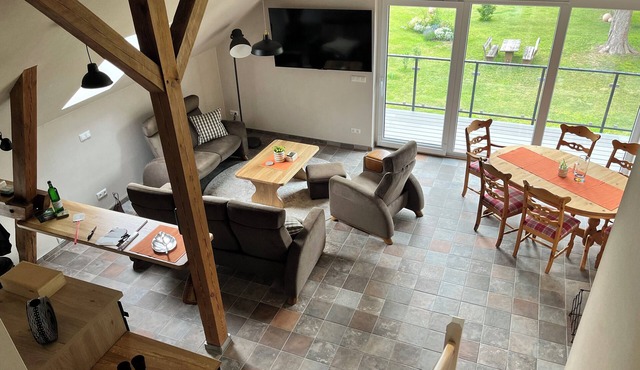Spacious penthouse apartment for all ages under one roof in an idyllic village setting with a sauna