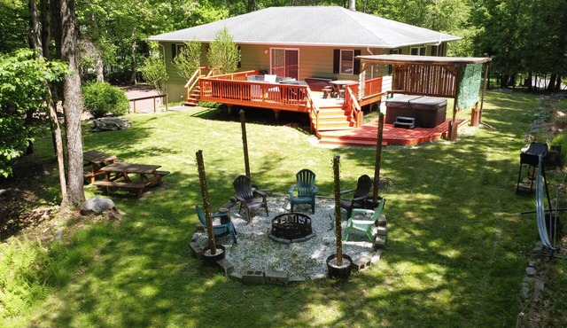 Spacious Poconos home with hot tub, firepit, fireplace, and game room