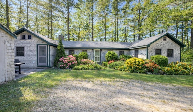 Spacious single-story cottage with ocean views, large screen porch, and a quiet location.